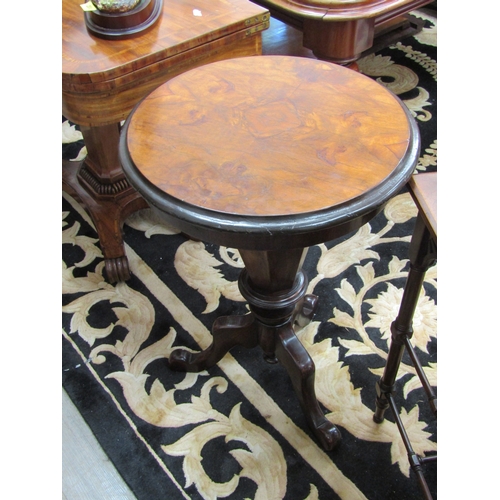 5501 - A Victorian walnut sewing table, faceted sides to tripod base