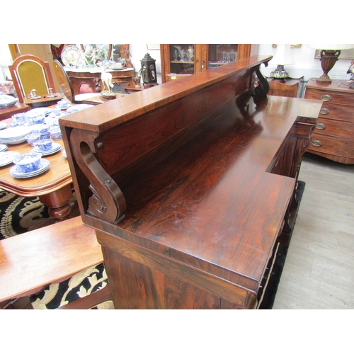 5511 - Circa 1830 a William IV rosewood breakfront chiffonier, the raised shelf back with caved 