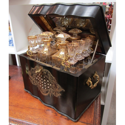 5516 - A 19th Century French serpentine liquor boulle work drinks cabinet, the rising lid activating a spru... 