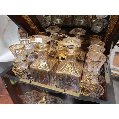 5516 - A 19th Century French serpentine liquor boulle work drinks cabinet, the rising lid activating a spru... 