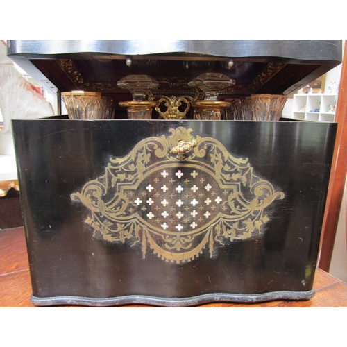 5516 - A 19th Century French serpentine liquor boulle work drinks cabinet, the rising lid activating a spru... 