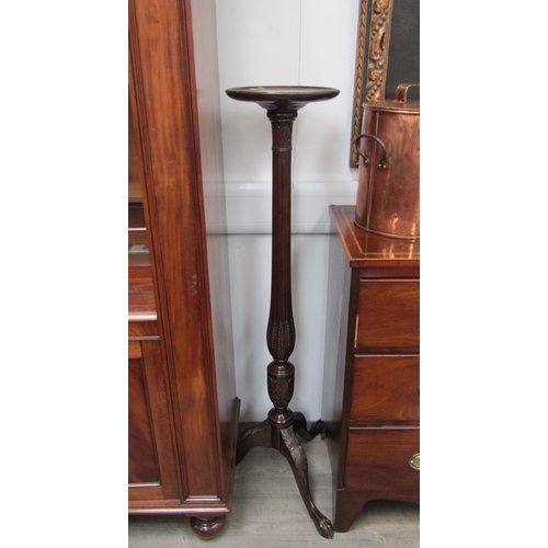 5677 - A late 19th/early 20th Century mahogany torchere with reeded and wheat ears column above an acanthus... 