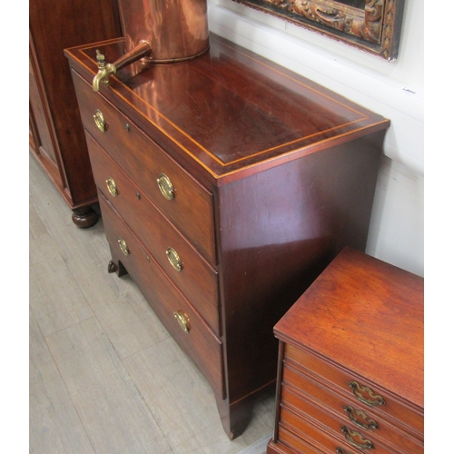 5680 - A 19th Century chest of three long drawers, satinwood inlaid top, oval brass handles, on bracket sup... 