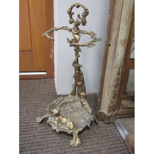 5685 - A Victorian brass umbrella/stick stand decorated with dog, gun and game