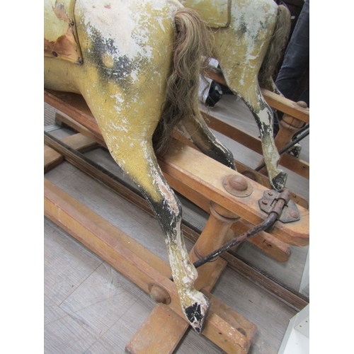 5686 - A late 19th Century/early 20th Century dapple rocking horse for restoration with later Triang Toys b... 