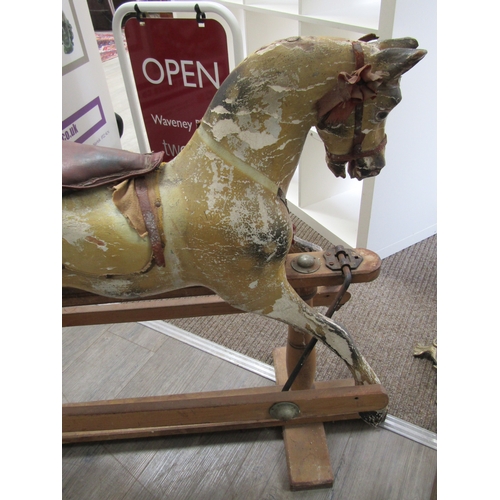 5686 - A late 19th Century/early 20th Century dapple rocking horse for restoration with later Triang Toys b... 