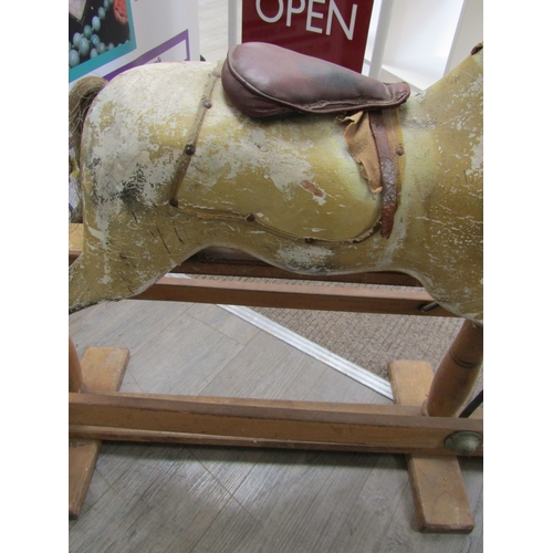 5686 - A late 19th Century/early 20th Century dapple rocking horse for restoration with later Triang Toys b... 