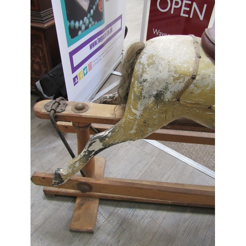 5686 - A late 19th Century/early 20th Century dapple rocking horse for restoration with later Triang Toys b... 