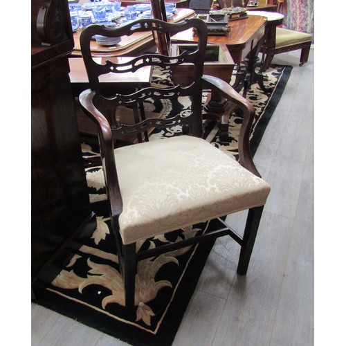 5510 - A Georgian mahogany Hepplewhite style armchair with fretted ladder back rest over chamfered square l... 