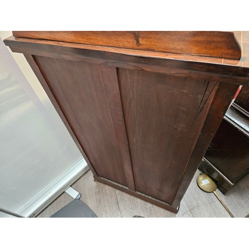 5694 - A late Victorian rosewood cabinet, gallery back over a half glazed single door with urn marquetry pa... 