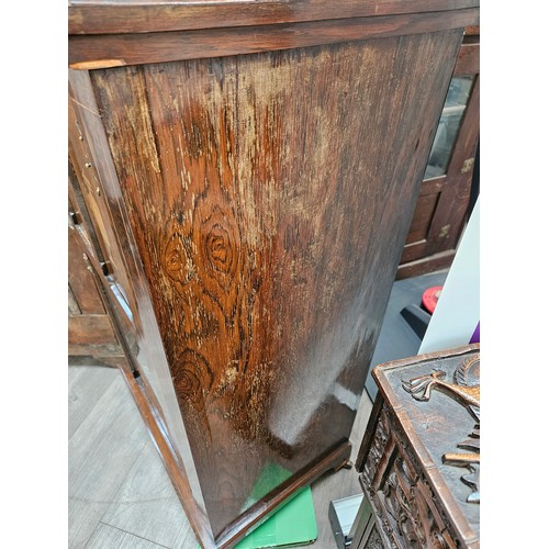 5694 - A late Victorian rosewood cabinet, gallery back over a half glazed single door with urn marquetry pa... 