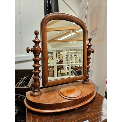 5693 - A Victorian mahogany dressing table mirror with barley twist supports, the bottom with a velvet line... 