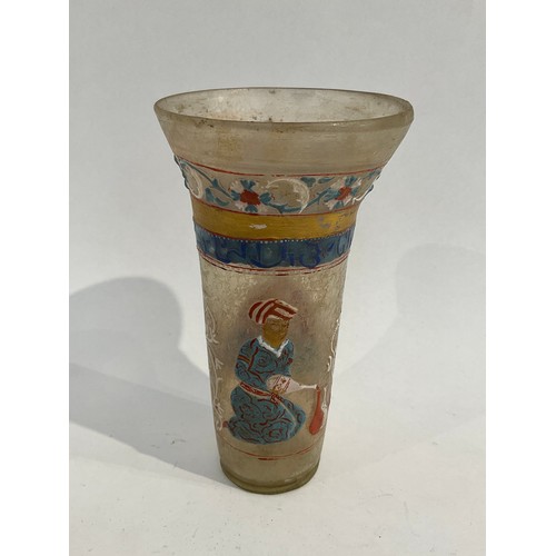 5053 - A Mughal glass beaker with flared rim painted with images of figures, with floral bands, 14cm high