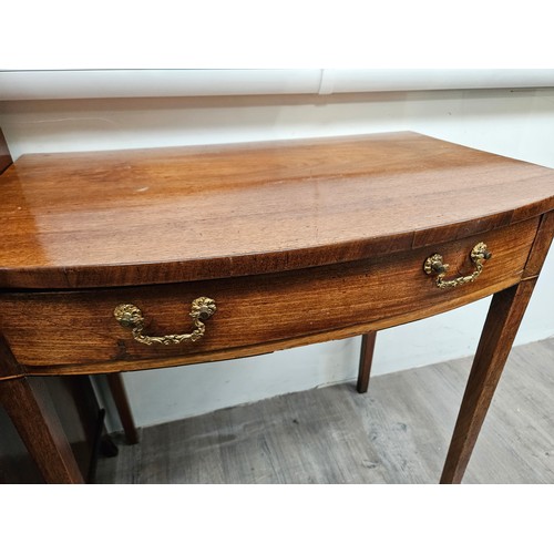 5691 - A 19th Century mahogany side table breakfront, single frieze drawer, raised on square tapering legs ... 