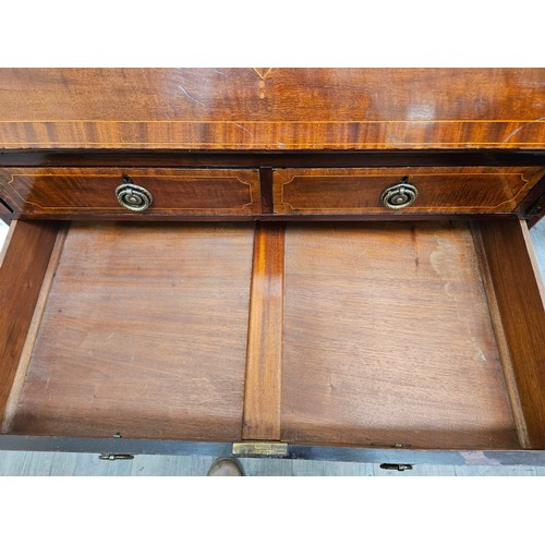 5689 - An Edwardian mahogany bureau with crossbanding and line inlaid decoration, the three drawer interior... 