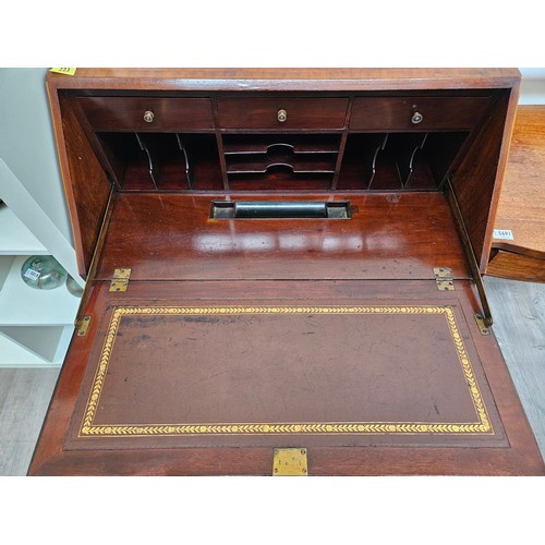 5689 - An Edwardian mahogany bureau with crossbanding and line inlaid decoration, the three drawer interior... 