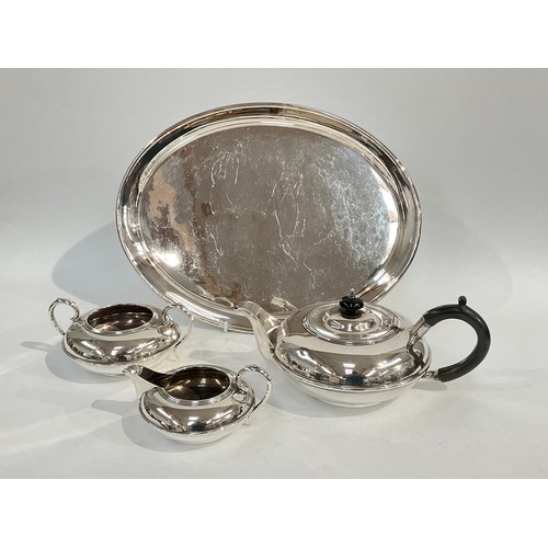 5067 - An E. Silver & Co. three piece tea set, banded detail, ebonised handle and knop to teapot, Sheffield... 