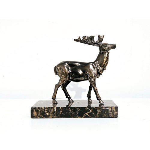 5676 - An early to Mid 20th Century cast metal stag figure mounted on marble plinth 15.5cm x 16cm  (E)  £15... 