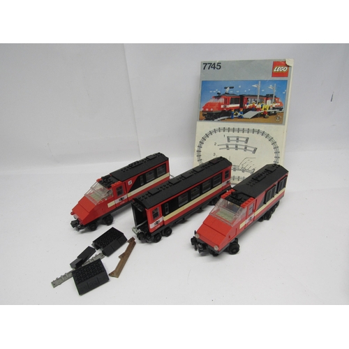 7044 - A collection of boxed 1980s Lego railway sets and accessories to include 7866 level crossing, 7864 1... 