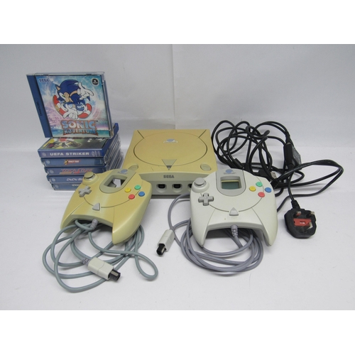 7008 - A Sega Dreamcast video game console with two controllers and six games including Sonic Adventure, UE... 