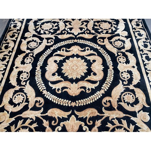 5703 - A G H FRITH Ltd -hand made oriental carpet, black ground with all over acanthus scrolling detail, 37... 