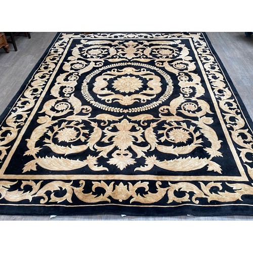 5703 - A G H FRITH Ltd -hand made oriental carpet, black ground with all over acanthus scrolling detail, 37... 