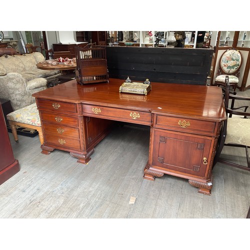 5512 - A reproduction partner’s desk, carved detail, on ogre bracket feet  (E)  £300-400