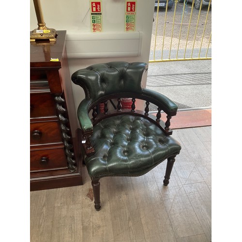 5480 - A buttoned green leather captain’s style desk chair