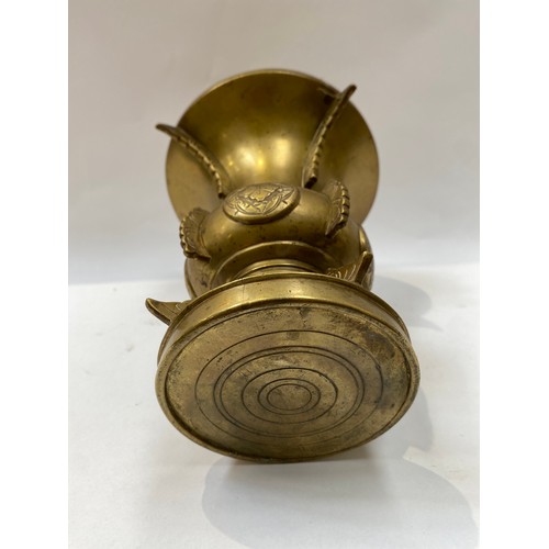 5035A - An Oriental brass vase, 17cm tall