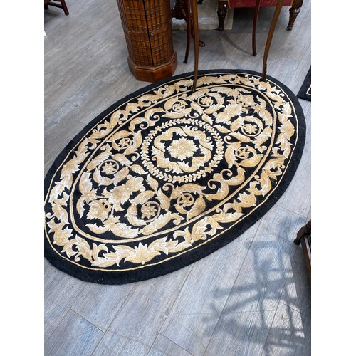 5698 - A G H FRITH Ltd, hand made Oriental carpet, black ground with all-over acanthus scrolling detail 242... 