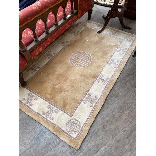 5699 - A G H FRITH  Ltd - handmade oriental rug with Chinese character symbol detail.  156cm x 90cm