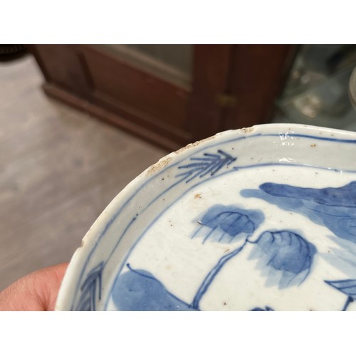 5028 - An 18th Century blue and white Chinese export lobed form tray with images of fishermen, boat and far... 