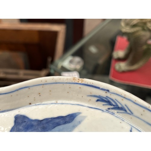 5028 - An 18th Century blue and white Chinese export lobed form tray with images of fishermen, boat and far... 