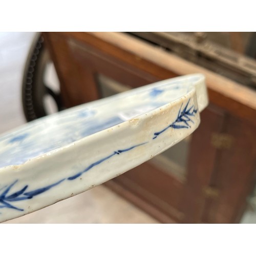 5028 - An 18th Century blue and white Chinese export lobed form tray with images of fishermen, boat and far... 