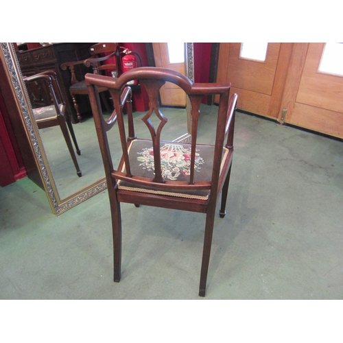 4020 - An Edwardian inlaid mahogany armchair with chequer strung decoration, the floral tapestry seat over ... 