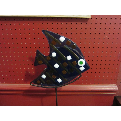 4057 - A candle stand as a blue glass fish on tall metal base, 45cm tall  (R)  £10