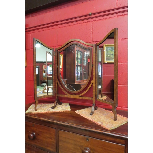 4146 - An Edwardian mahogany shield shape triptych dressing chest mirror on an arched scroll foot base, 71.... 