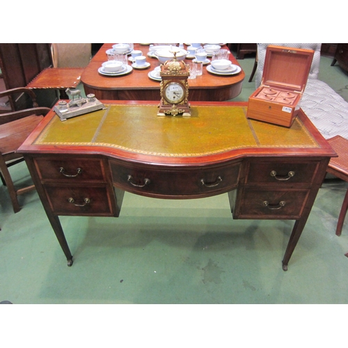 4167 - An Edwardian crossbanded mahogany breakfront desk the gilt tooled leather writing surface over a cen... 