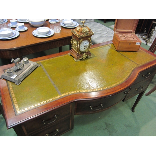 4167 - An Edwardian crossbanded mahogany breakfront desk the gilt tooled leather writing surface over a cen... 
