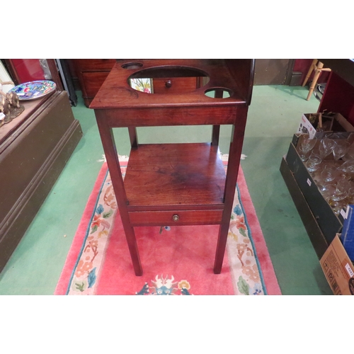4170 - A George III mahogany two tier gentleman's corner washstand, the raised back over bowl recesses on s... 