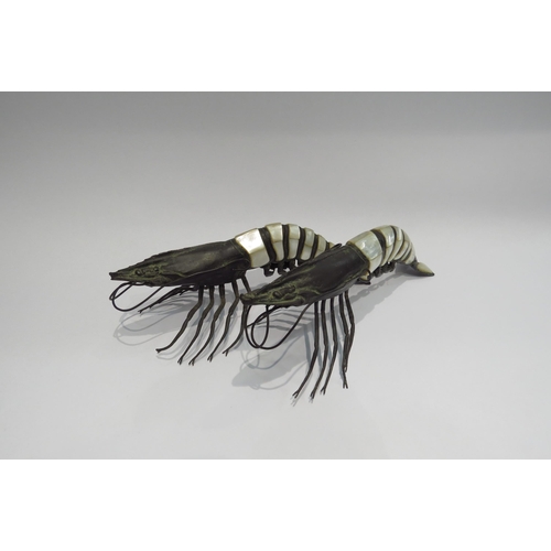 4323 - A pair of 19th Century mother-of-pearl and bronze knife rests of prawn form, 26cm long  (C)