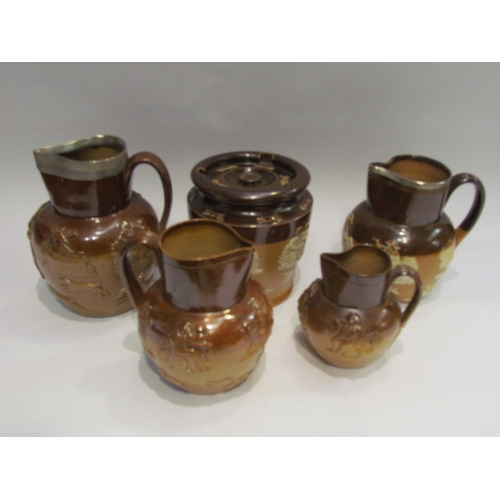 4336 - Two Royal Doulton harvest jugs with silver rims, two other harvest ware jugs and a tobacco jar (5)