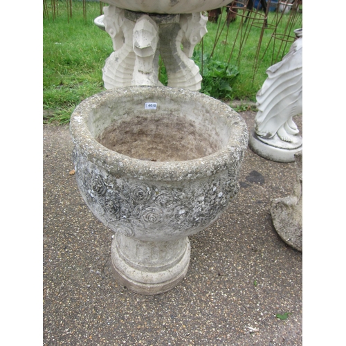 6010 - A composition rose pattern garden planter on plinth, 24