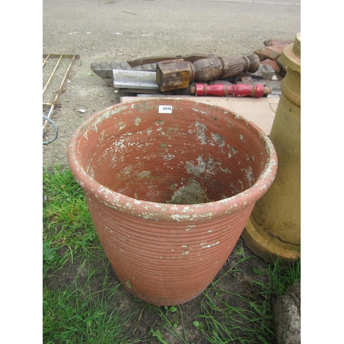 6045 - A large terracotta ribbed pot, 18