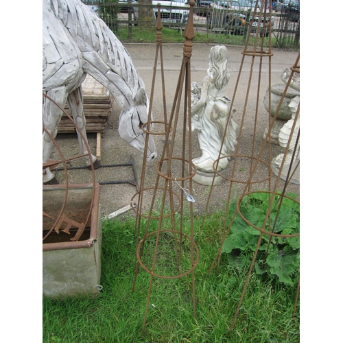 6061 - A pair of steel arrow top obelisks