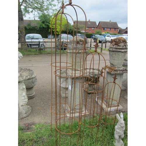 6065 - A pair of steel wavy arrow top obelisks