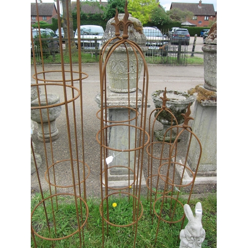 6066 - A pair of steel wavy arrow top obelisks