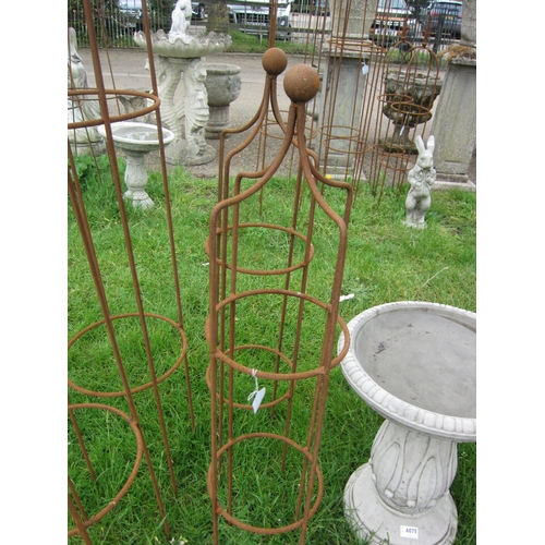 6076 - A pair of steel ball top obelisks