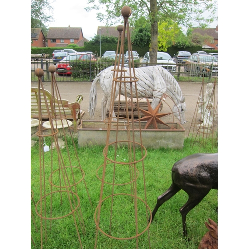 6081 - A pair of steel ball top obelisks