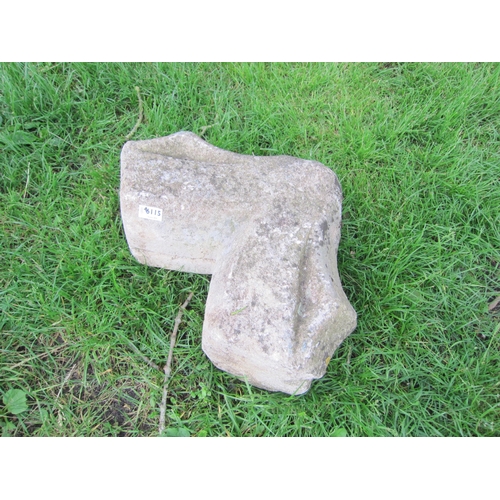 6115 - A weathered shaped stone section     (R)